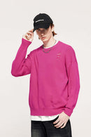 Distressed Washed Stretch-Knit Sweater in Pink - front modeled close-up