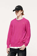 Distressed Washed Stretch-Knit Sweater in Pink - three-quarter front modeled view
