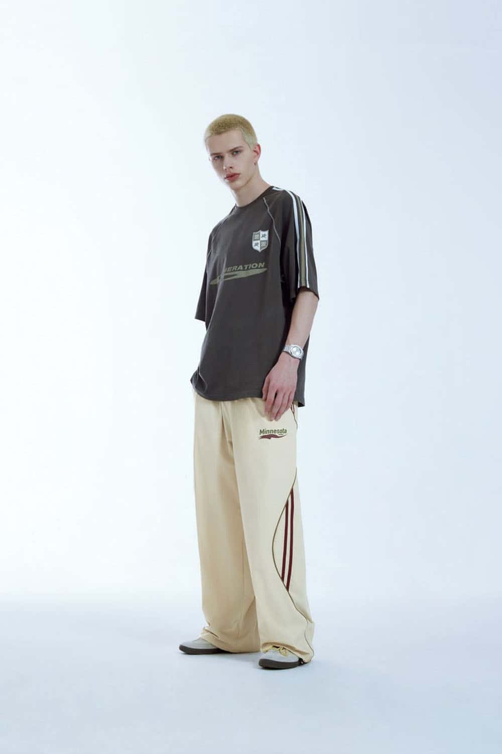 Curved-Panel Graphic Wide-Leg Pants in Light Khaki - full-length front modeled view