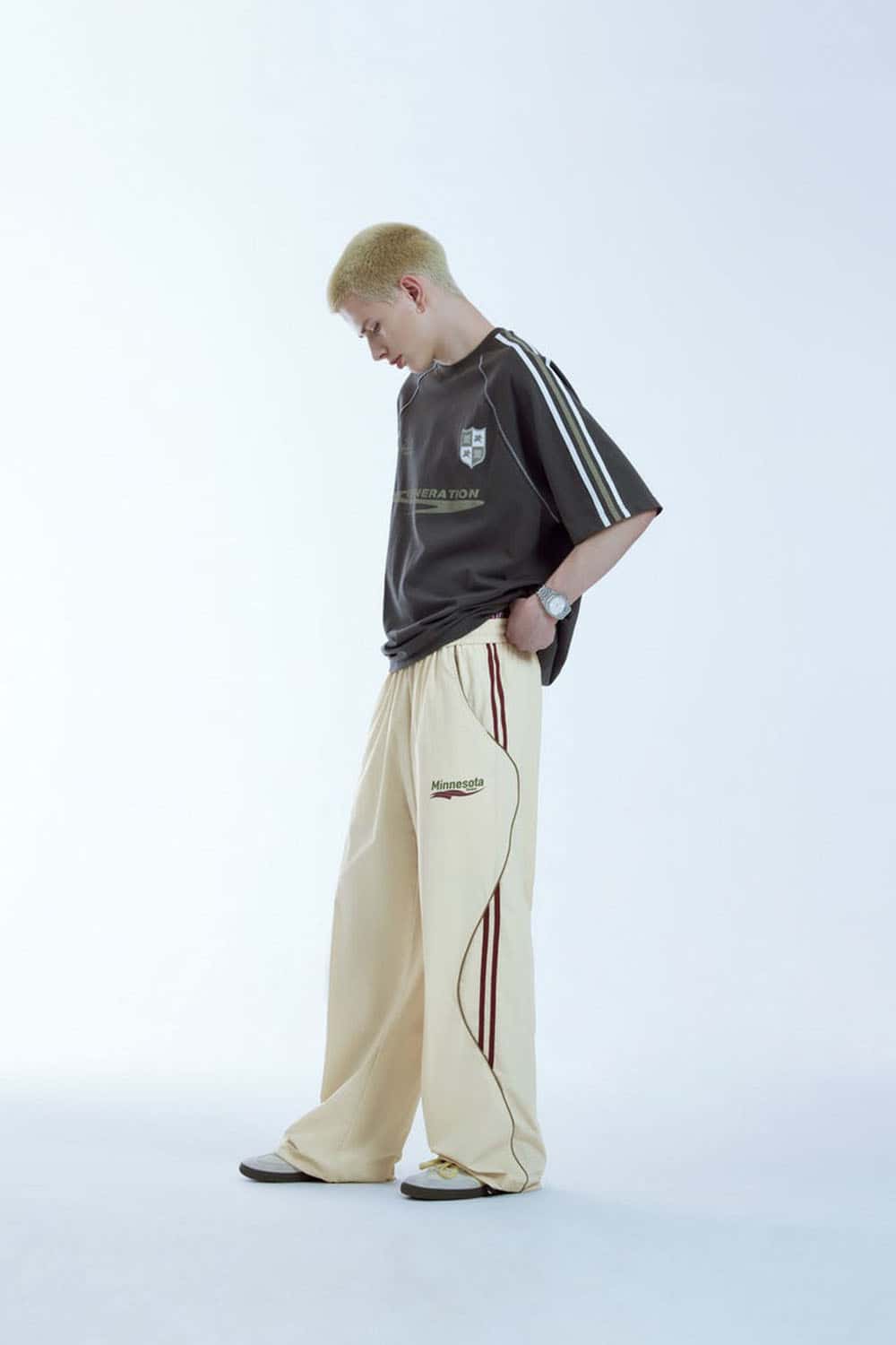 Curved-Panel Graphic Wide-Leg Pants in Light Khaki - full-length side modeled view