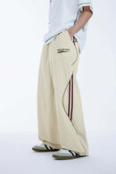 Curved-Panel Graphic Wide-Leg Pants in Light Khaki - side modeled view