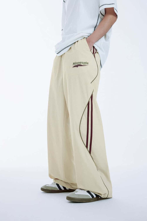 Curved-Panel Graphic Wide-Leg Pants in Light Khaki - side modeled view