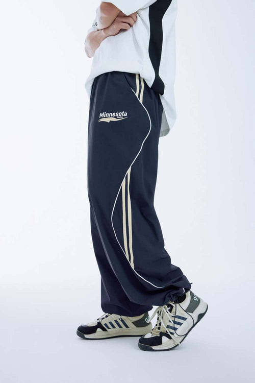 Curved-Panel Graphic Wide-Leg Pants in Royal Blue - rear three-quarter modeled view