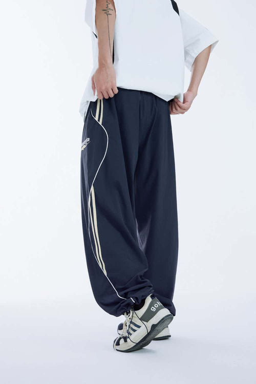 Curved-Panel Graphic Wide-Leg Pants in Royal Blue - front modeled view