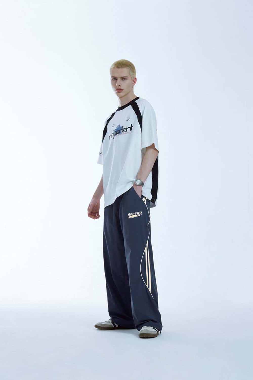 Curved-Panel Graphic Wide-Leg Pants in Royal Blue - full-length front modeled view
