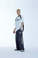 Curved-Panel Graphic Wide-Leg Pants in Royal Blue - full-length front modeled view