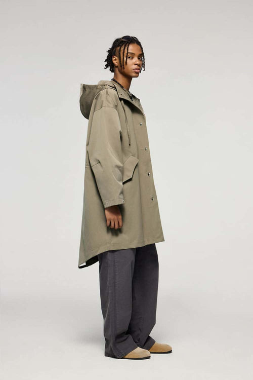 Waterproof Hooded Fishtail Utility Parka in Green - full-length side modeled view