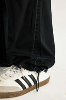 Washed Slub Cotton Wide-Leg Trousers in Black - product detail close-up
