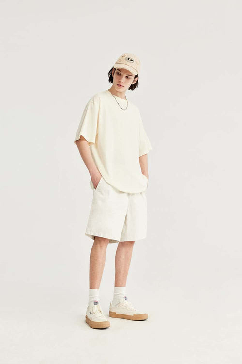 High-Colorfastness Washed Reversible Cotton Shorts in Apricot - full-length front modeled view