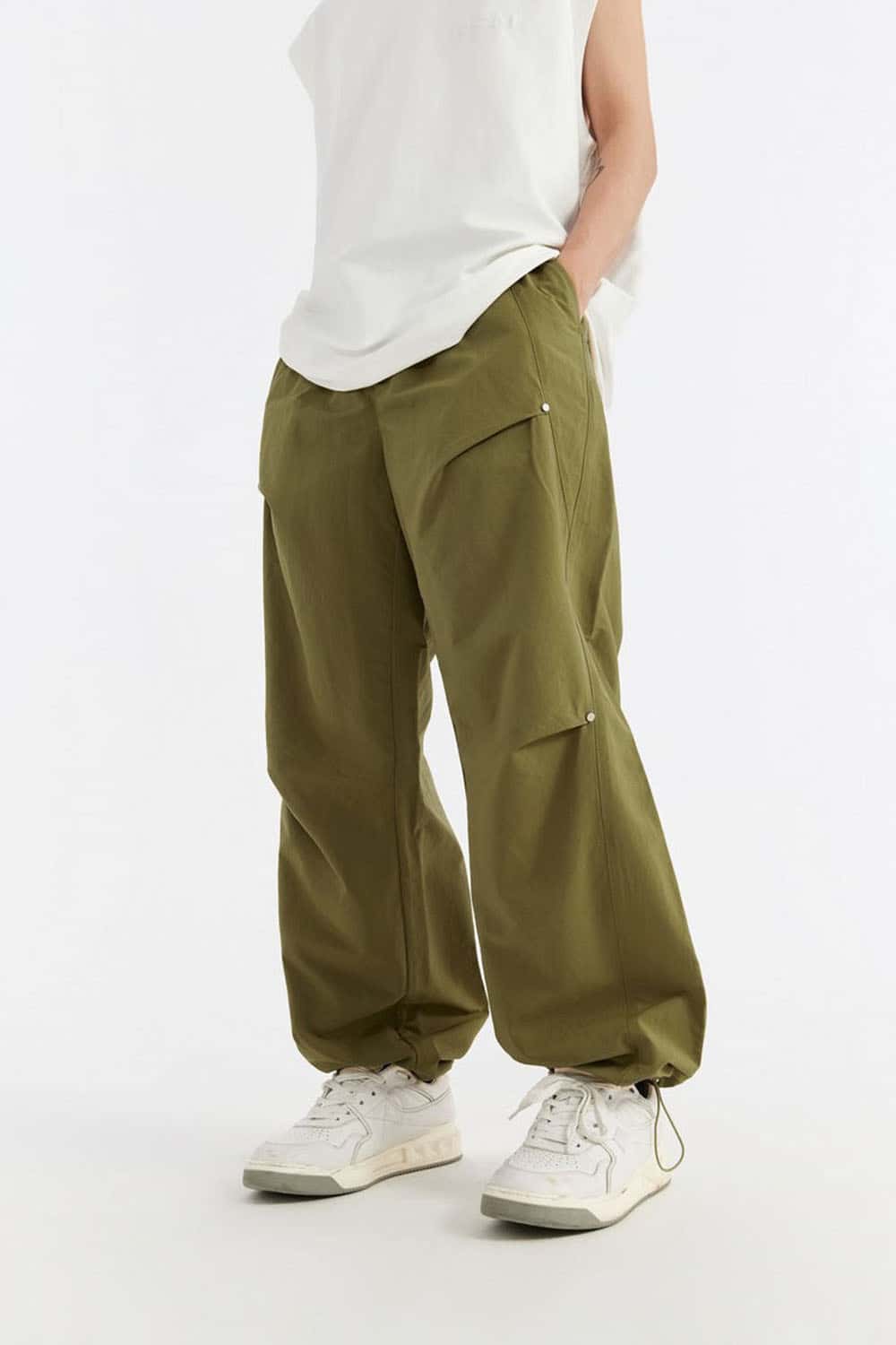 Double-Pleated Rivet-Detail Wide-Leg Cargo Pants in Green - front modeled view