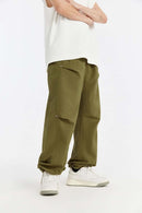 Double-Pleated Rivet-Detail Wide-Leg Cargo Pants in Green - front modeled view
