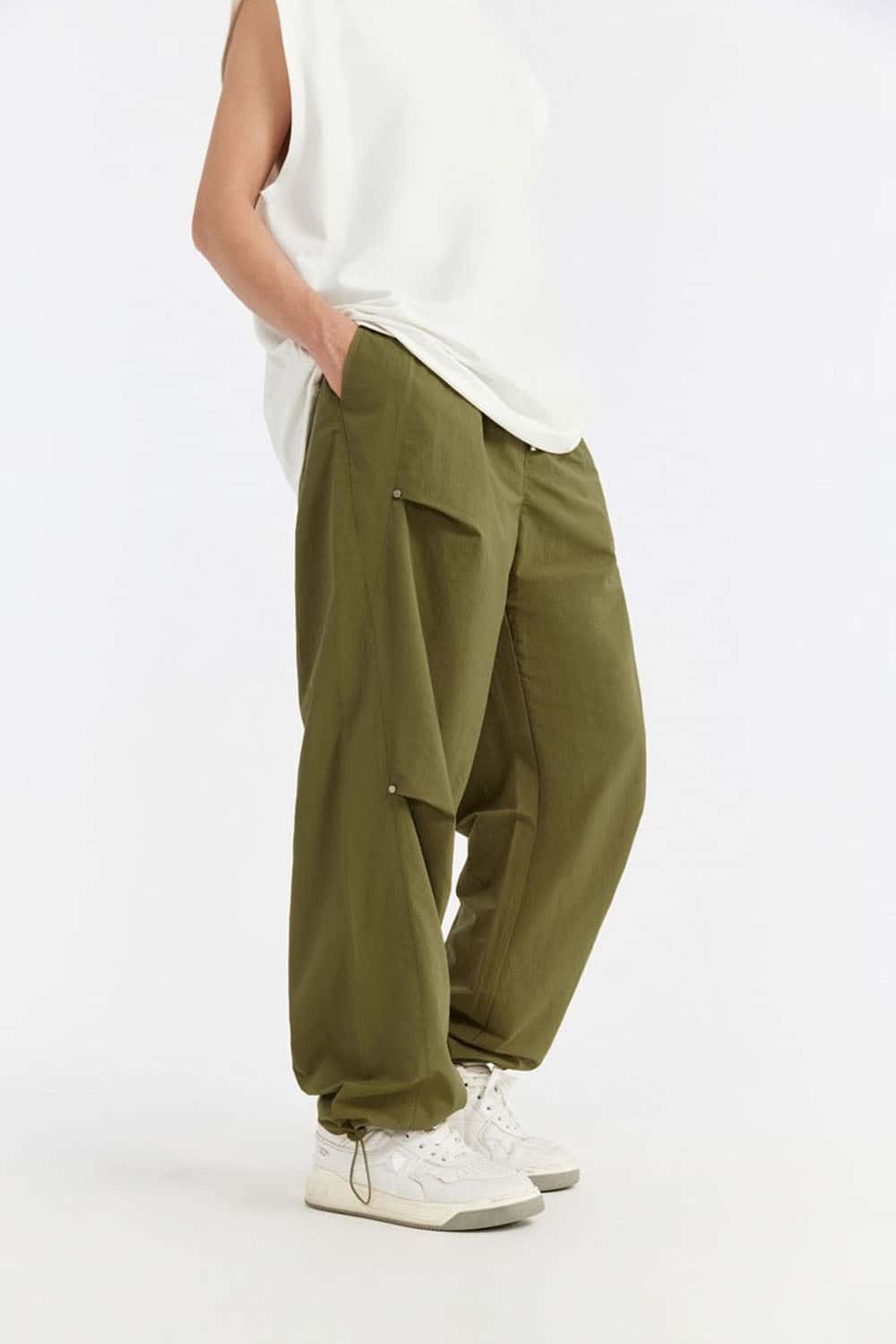 Double-Pleated Rivet-Detail Wide-Leg Cargo Pants in Green - front modeled view