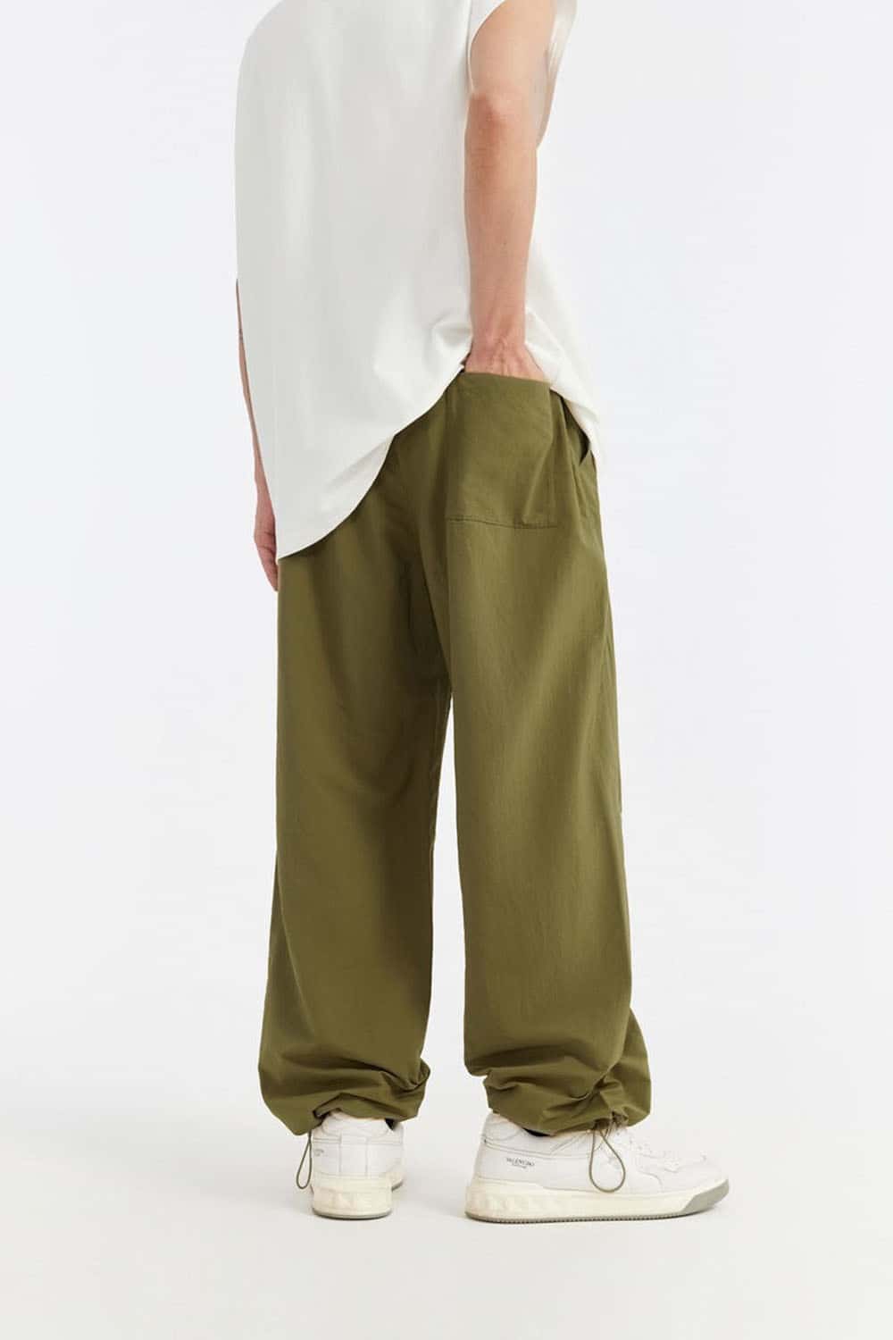 Double-Pleated Rivet-Detail Wide-Leg Cargo Pants in Green - back modeled view