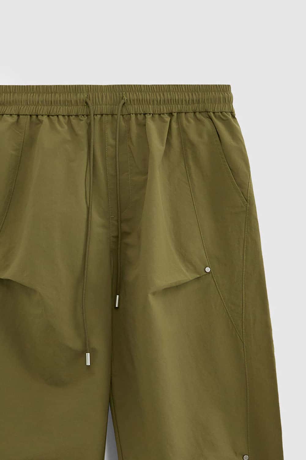 Double-Pleated Rivet-Detail Wide-Leg Cargo Pants in Green - front modeled view