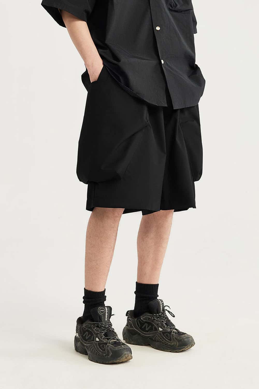 Loose-Fit Multi-Pocket Cargo Shorts in Black - front modeled close-up