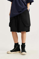 Loose-Fit Multi-Pocket Cargo Shorts in Black - front modeled view