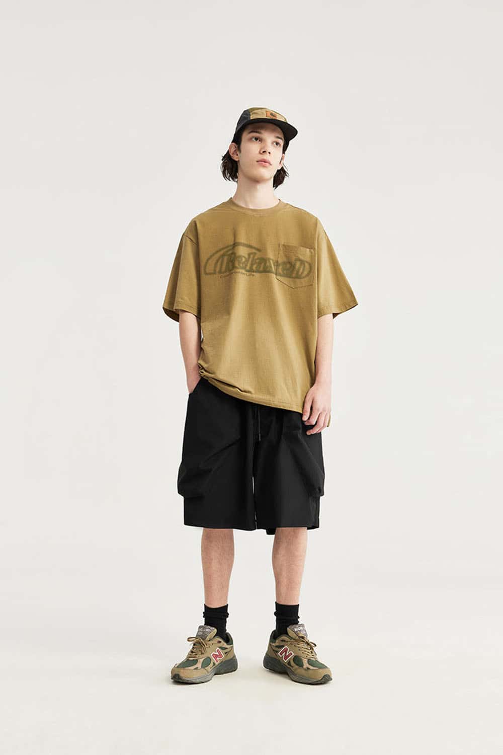 Loose-Fit Multi-Pocket Cargo Shorts in Black - full-length front modeled view
