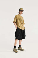 Loose-Fit Multi-Pocket Cargo Shorts in Black - full-length modeled view