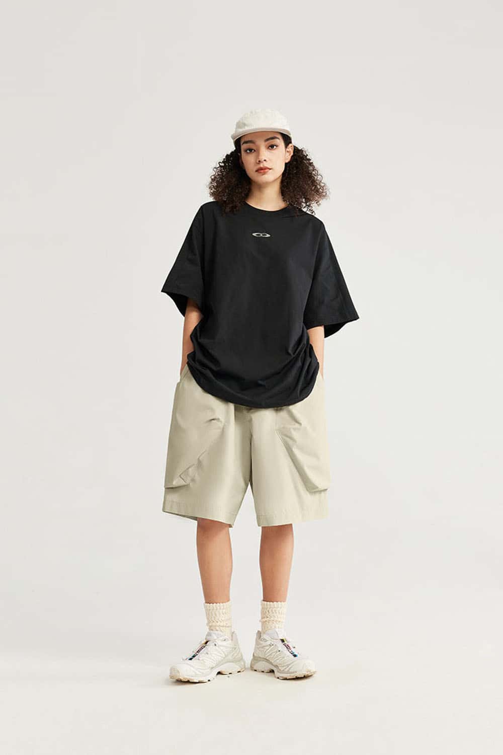 Loose-Fit Multi-Pocket Cargo Shorts in Ivory White - full-length front modeled view