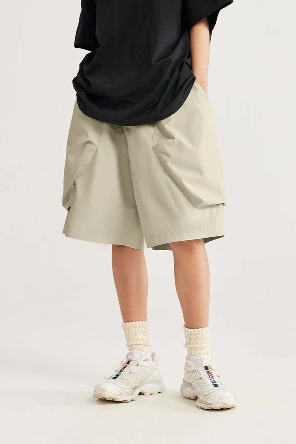 Loose-Fit Multi-Pocket Cargo Shorts in Ivory White - front modeled view