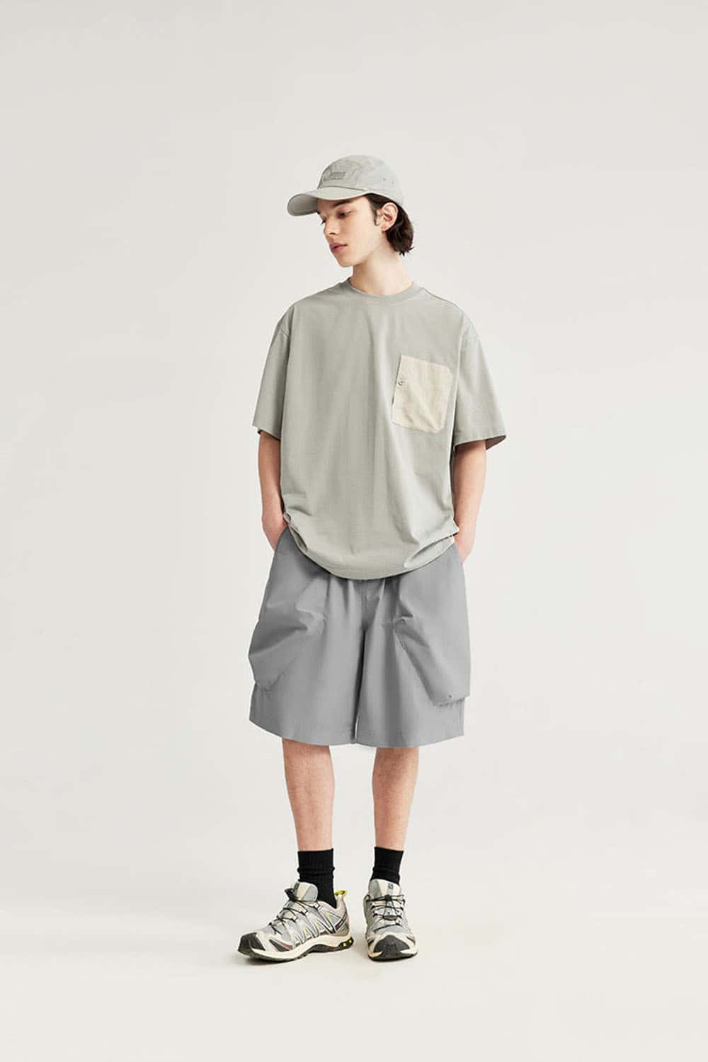 Loose-Fit Multi-Pocket Cargo Shorts in Light Gray - full-length front modeled view