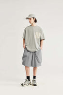 Loose-Fit Multi-Pocket Cargo Shorts in Light Gray - full-length front modeled view