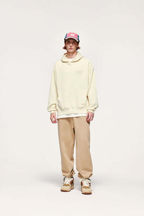 Embroidered Vertical-Rib Relaxed Pullover Hoodie in Apricot - full-length front modeled view