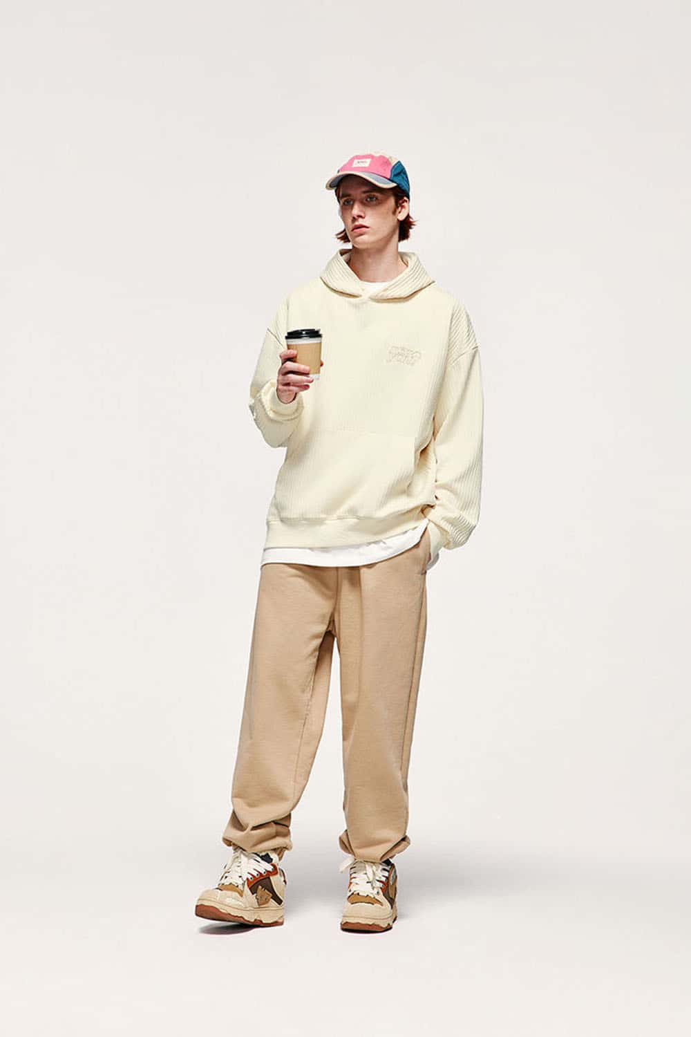 Embroidered Vertical-Rib Relaxed Pullover Hoodie in Apricot - full-length front modeled view