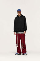 Embroidered Vertical-Rib Relaxed Pullover Hoodie in Black - full-length front modeled view