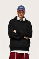 Embroidered Vertical-Rib Relaxed Pullover Hoodie in Black - front modeled view