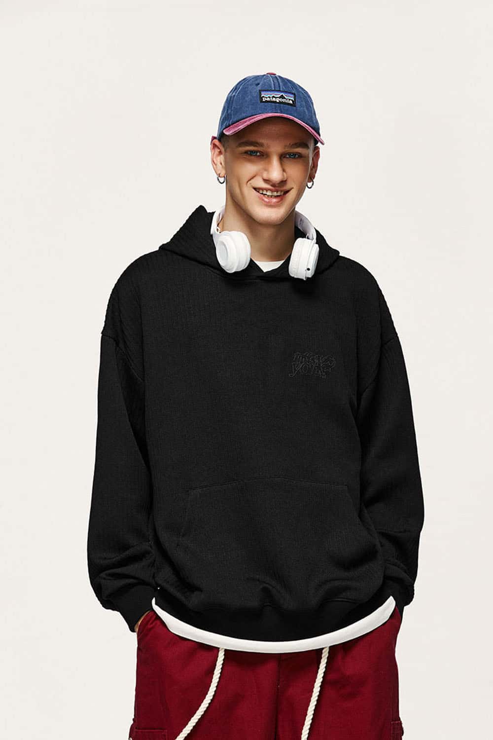 Embroidered Vertical-Rib Relaxed Pullover Hoodie in Black - front modeled view