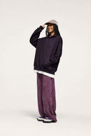 Embroidered Vertical-Rib Relaxed Pullover Hoodie in Purple - three-quarter front modeled view