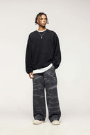 Washed Cotton Wide-Leg Carpenter Pants in Black - full-length front modeled view