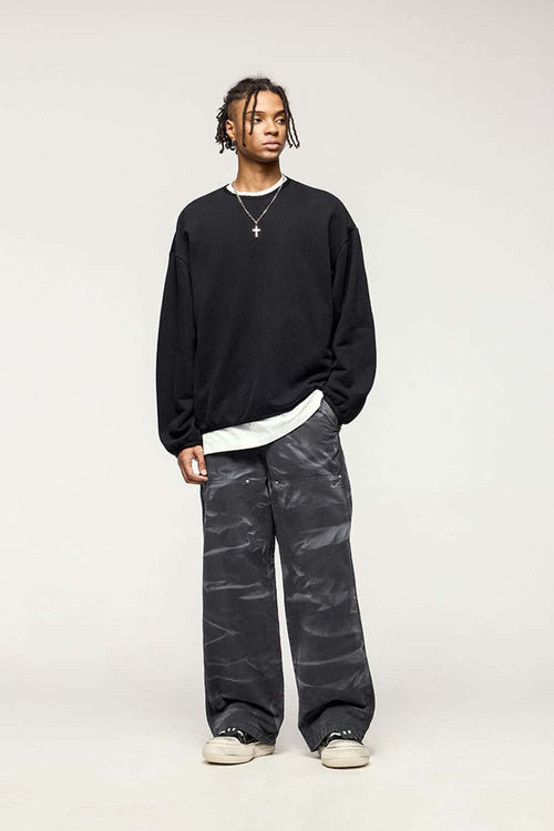 Washed Cotton Wide-Leg Carpenter Pants in Black - full-length front modeled view