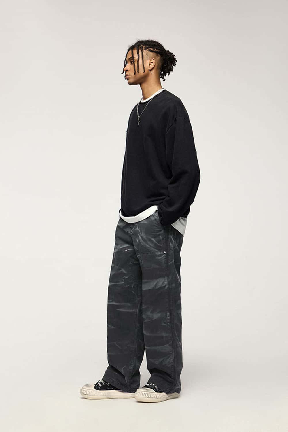 Washed Cotton Wide-Leg Carpenter Pants in Black - three-quarter front modeled view