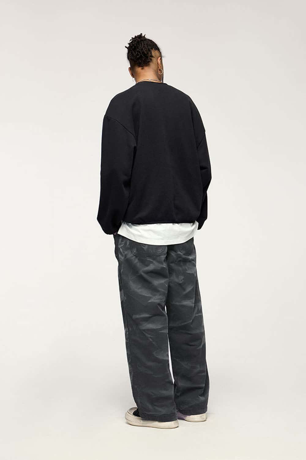 Washed Cotton Wide-Leg Carpenter Pants in Black - full-length back modeled view
