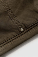 Washed Cotton Wide-Leg Carpenter Pants in Khaki Green - fabric texture close-up