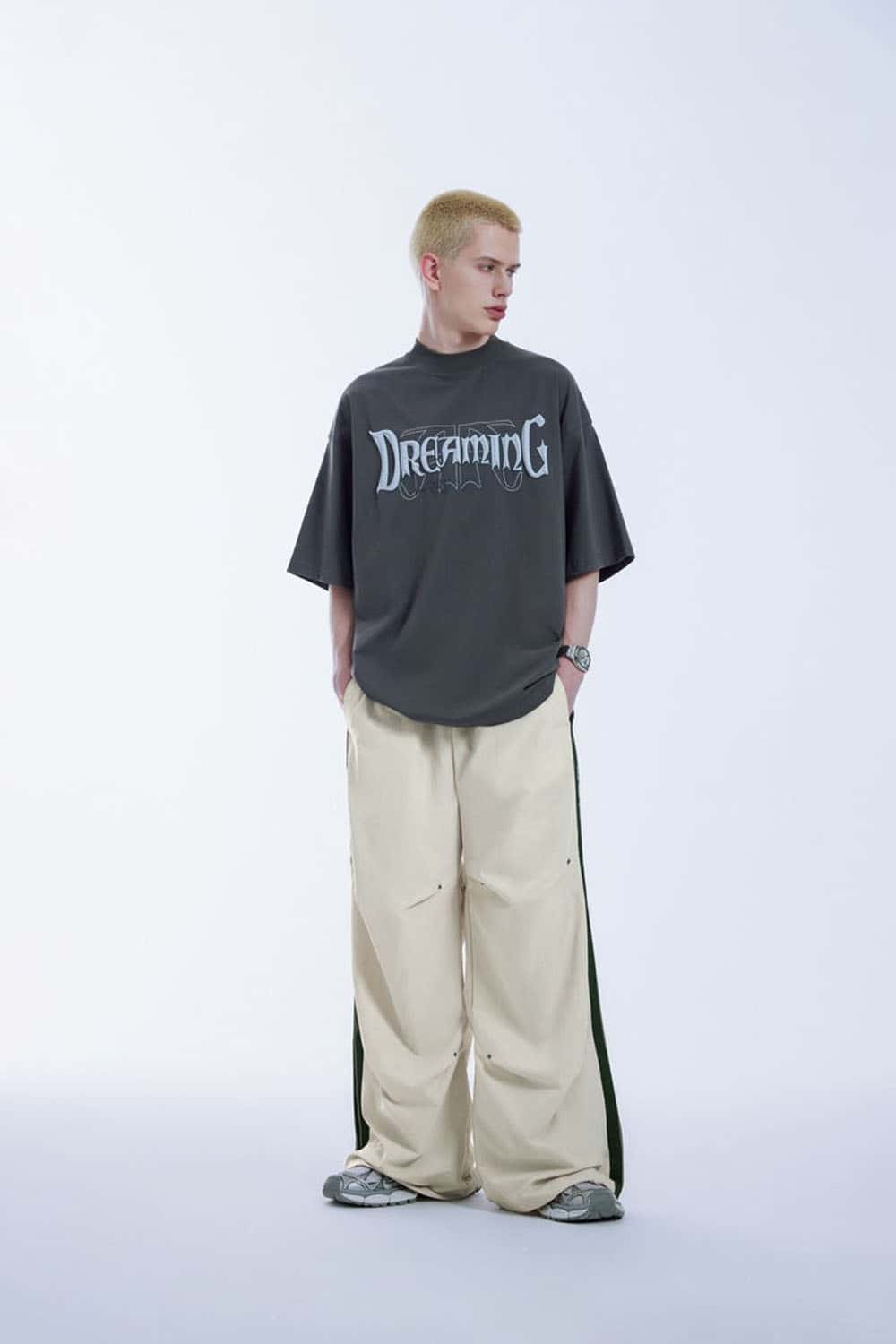 Striped Drawstring Loose Parachute Pants in Apricot - full-length front modeled view