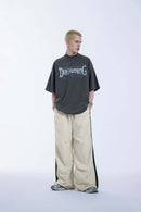 Striped Drawstring Loose Parachute Pants in Apricot - full-length front modeled view