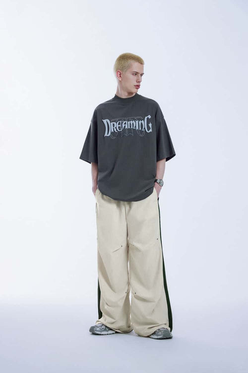 Striped Drawstring Loose Parachute Pants in Apricot - full-length front modeled view