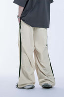 Striped Drawstring Loose Parachute Pants in Apricot - product detail close-up