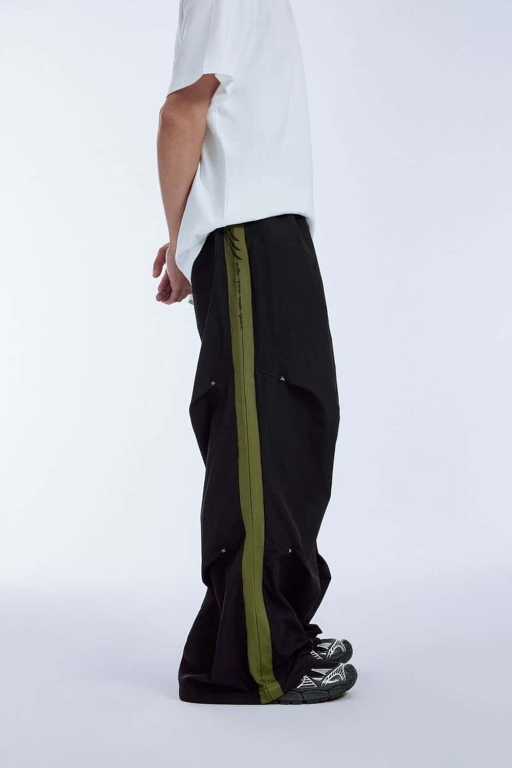 Striped Drawstring Loose Parachute Pants in Black - product detail close-up
