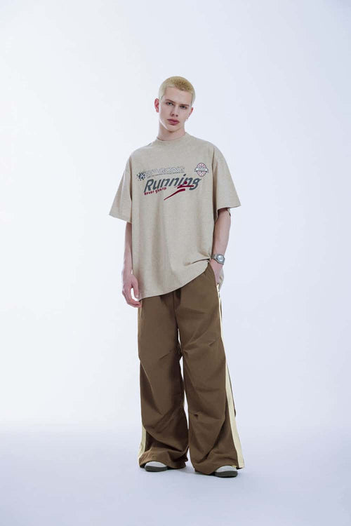 Striped Drawstring Loose Parachute Pants in Brown - full-length front modeled view