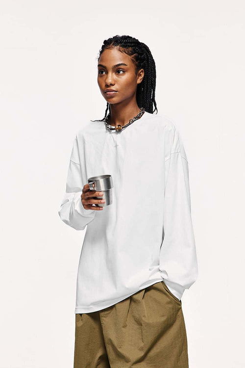 Quick-Drying Relaxed Drop-Shoulder Long-Sleeve T-Shirt in White - three-quarter front modeled view