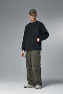 Drop-Shoulder Kangaroo-Pocket Fleece Sweatshirt in Black - full-length front modeled view