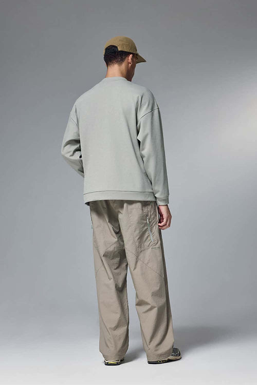 Drop-Shoulder Kangaroo-Pocket Fleece Sweatshirt in Stone Gray - full-length back modeled view