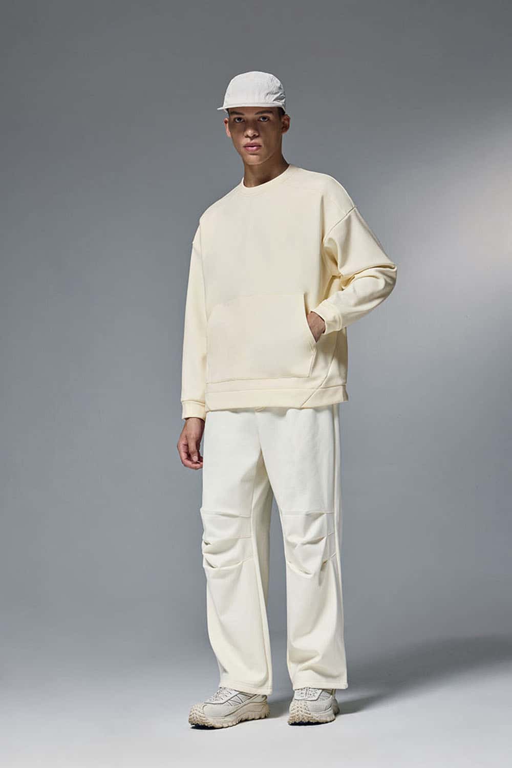 Drop-Shoulder Kangaroo-Pocket Fleece Sweatshirt in White - full-length front modeled view
