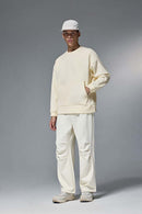 Drop-Shoulder Kangaroo-Pocket Fleece Sweatshirt in White - full-length front modeled view