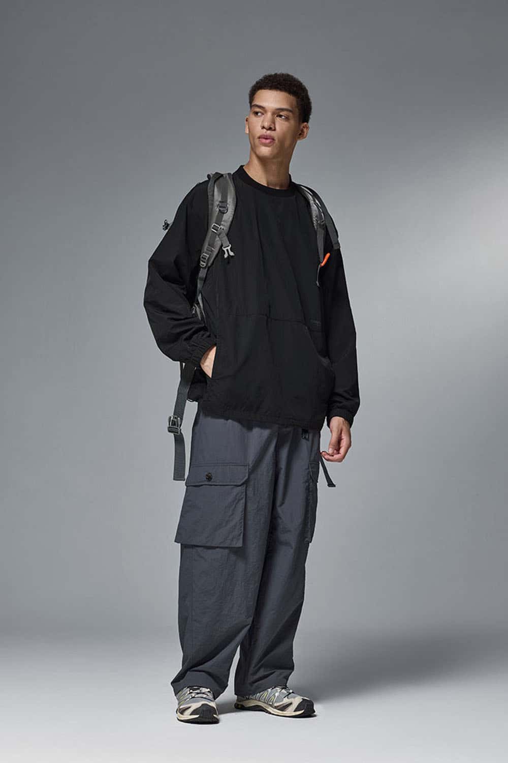 Utility Pocket Nylon Long-Sleeve Pullover in Black - full-length front modeled view