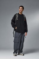 Utility Pocket Nylon Long-Sleeve Pullover in Black - full-length front modeled view